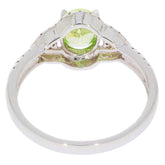 Green Peridot 14K white gold ring showcasing a sparkling gemstone and elegant design.